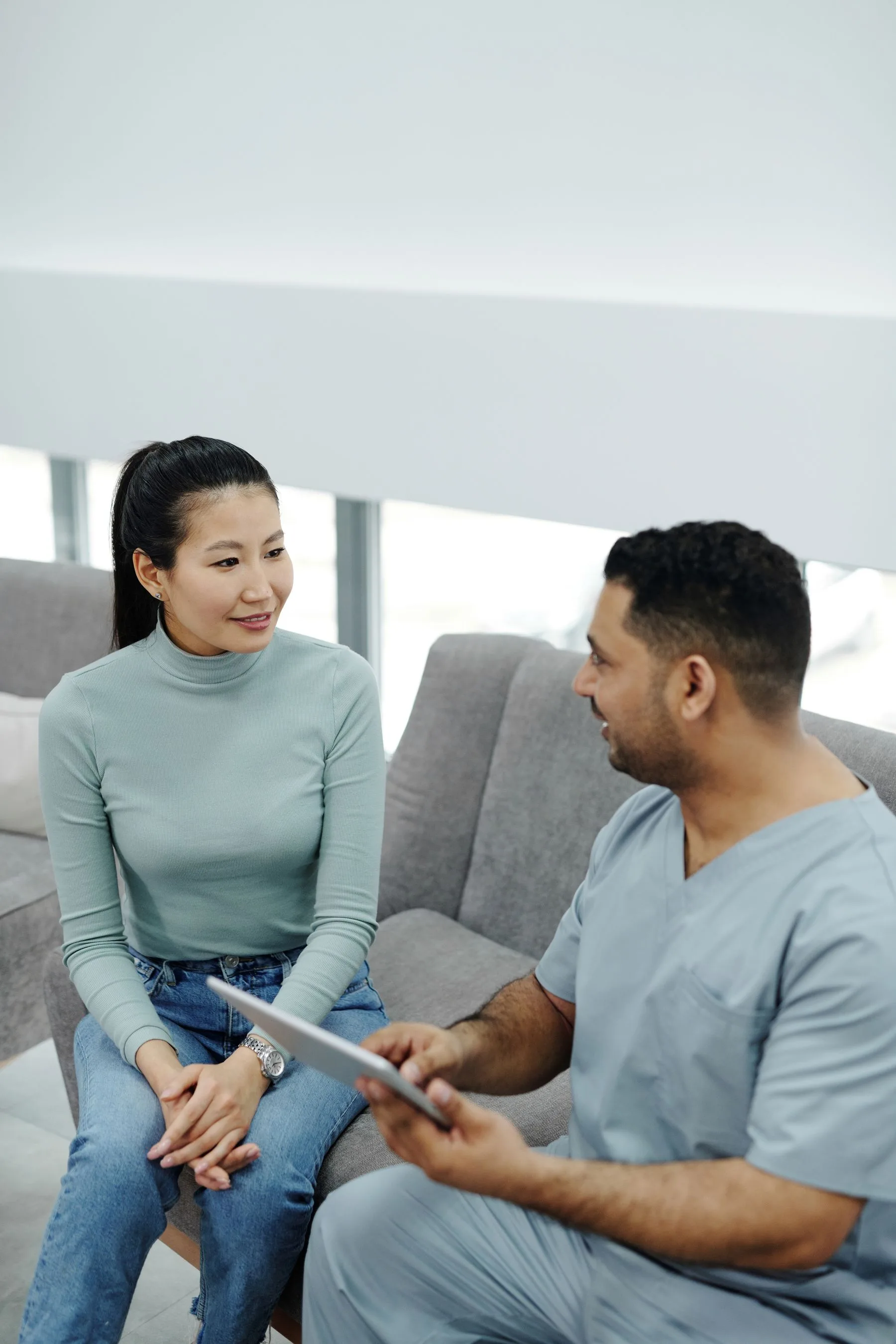 A practitioner listening during a calm consultation